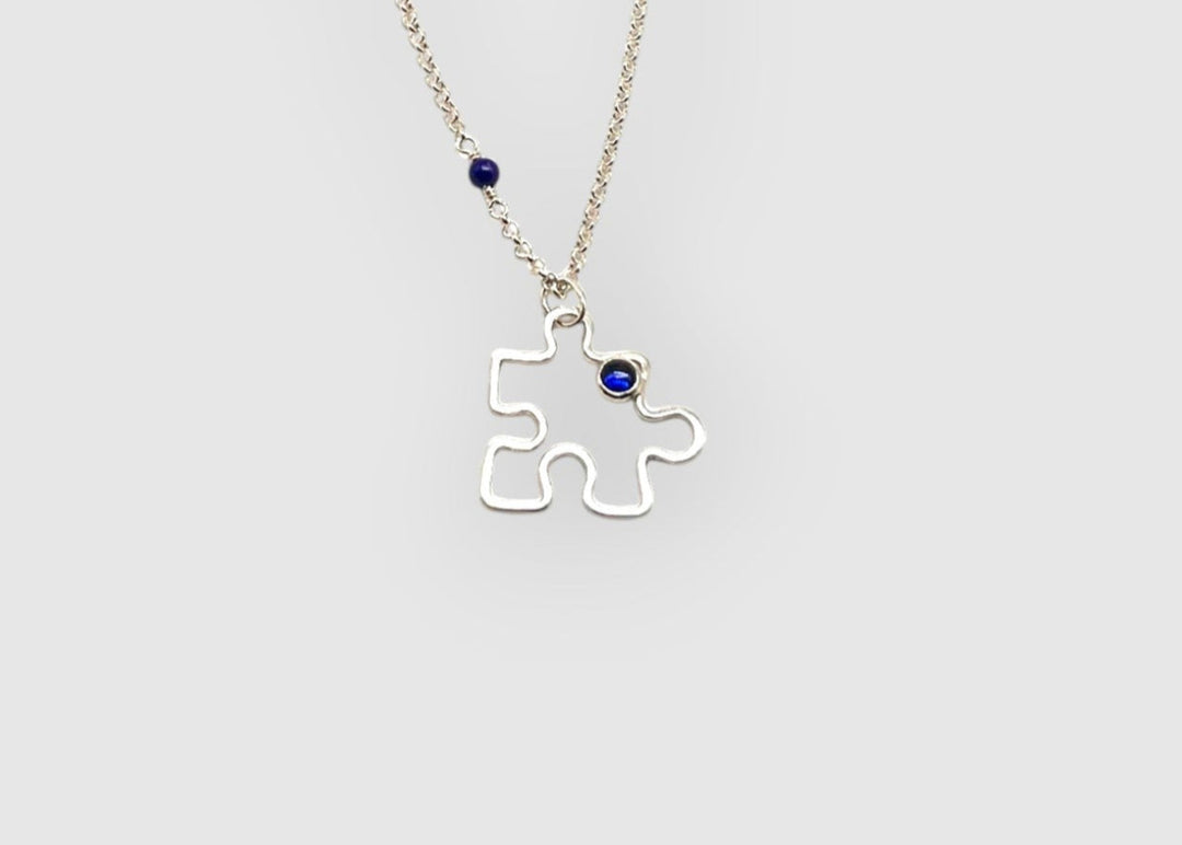 Autism Awareness Necklace Puzzle Piece 1 on white background