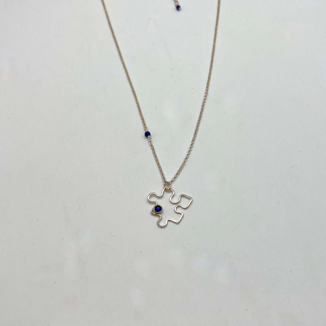 Autism Awareness Necklace Puzzle Piece 3 on white background