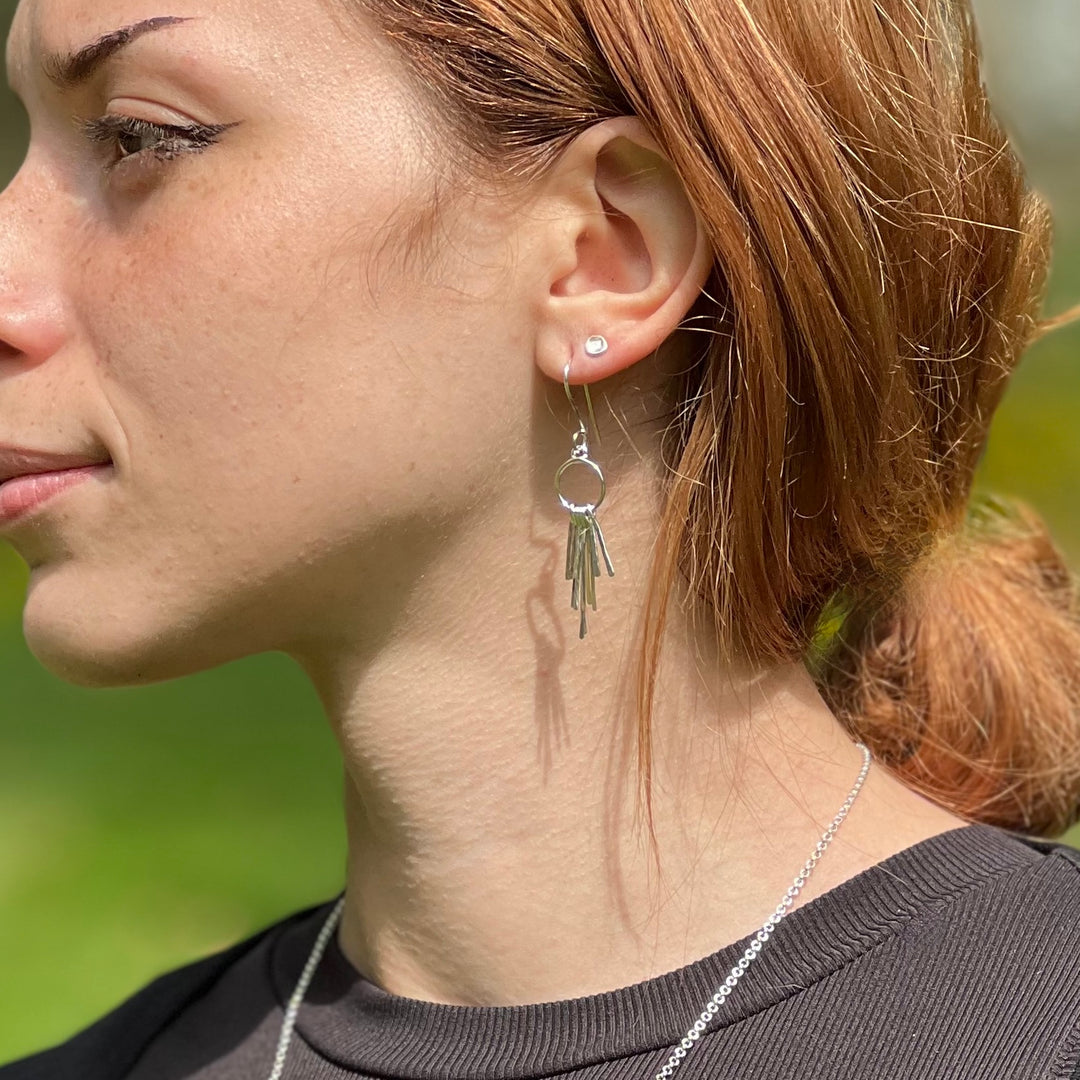 Feather Earrings Matoaka earrings on lady with red hair in a pony tail, sideview