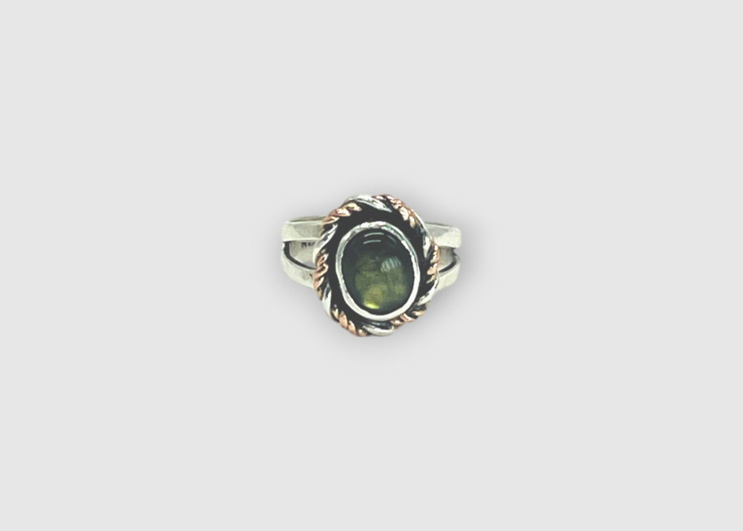 Mixed metal ring with labradorite on white background