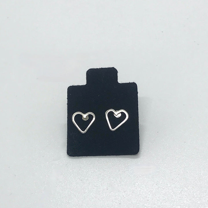 post earrings open hearts silver on black and white background